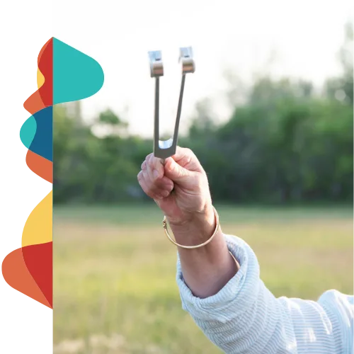 Linda holding a tuning fork